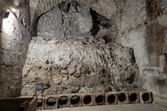 Stone water pipe blocks and unexcavated portion of the basement.
