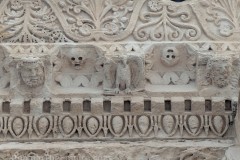 Reliefs on the lintel of the Temple of Jupiter with depictions of Hercules, Jupiter, and an eagle.