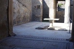 Tablinum of the Casa del Frutteto at Pompeii, looking out over the atrium and entrance of the house.