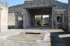 Atrium and tablinum of the Domus of Lucius Caecilius Jacundus at Pompeii. It faces the atrium in the foreground and opens out onto a garden beyond it.