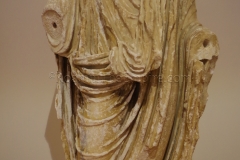 Togated statue dating to the second half of the 1st century CE. Displayed in the Museo Civico.
