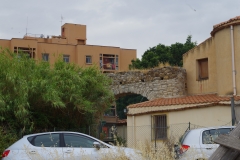 Remains of the aqueduct built into modern buildings.