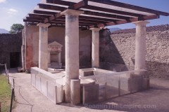 Summer triclinium with permanent lecti in the House of the Ephebe at Pompeii.