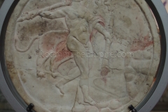 Oscillum with a depiction of Bacchus and a panther. Dated to the 2nd century CE. Displayed in the Musée Archéologique Saint-Pierre.