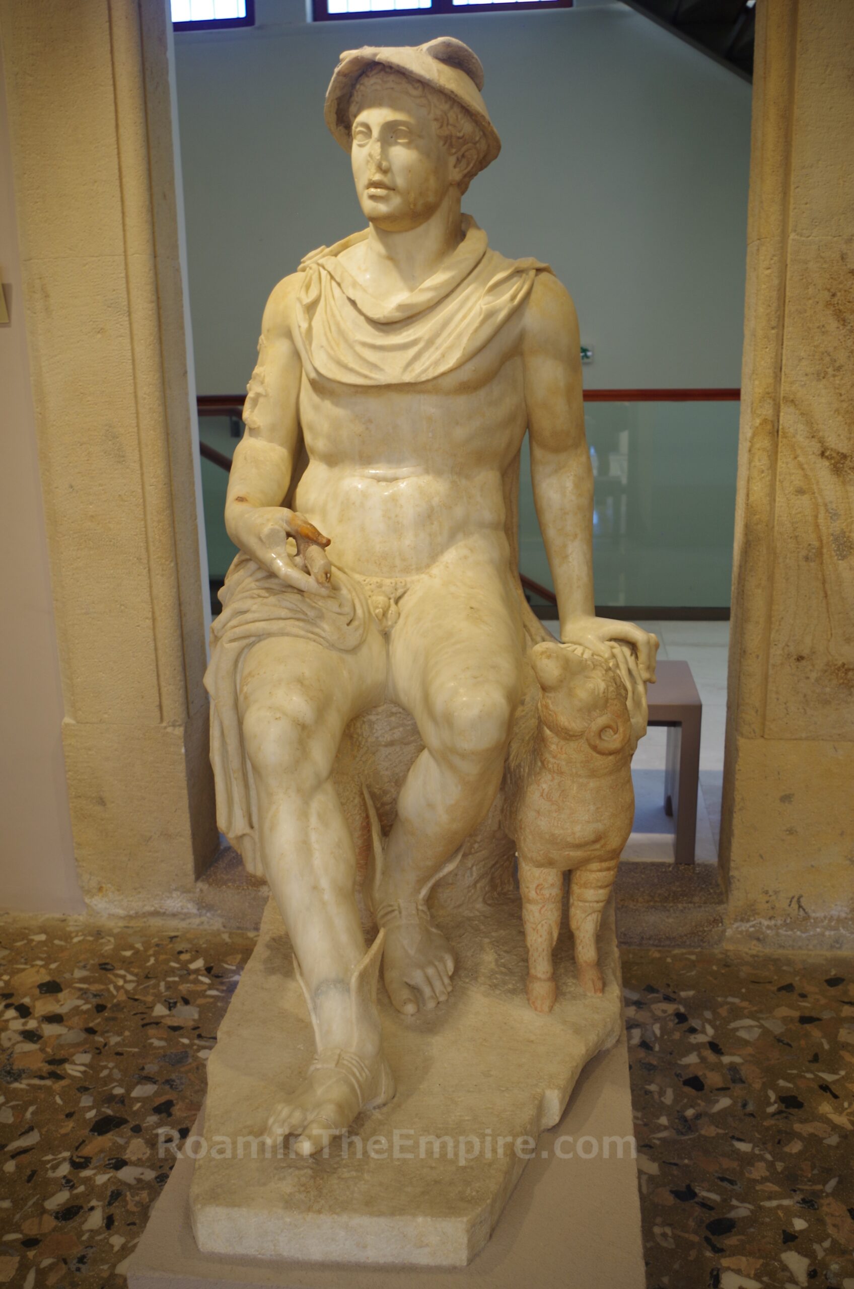 Statue of Hermes Eumelus seated on a rock. Dated to 150-200 CE. Archaeological Museum of Kos.