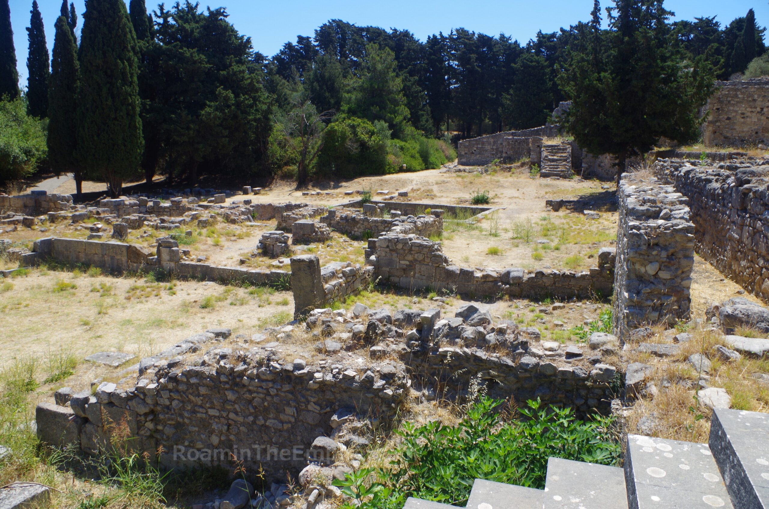 Hospitium and baths below the lower terrace from the entrance propylon.