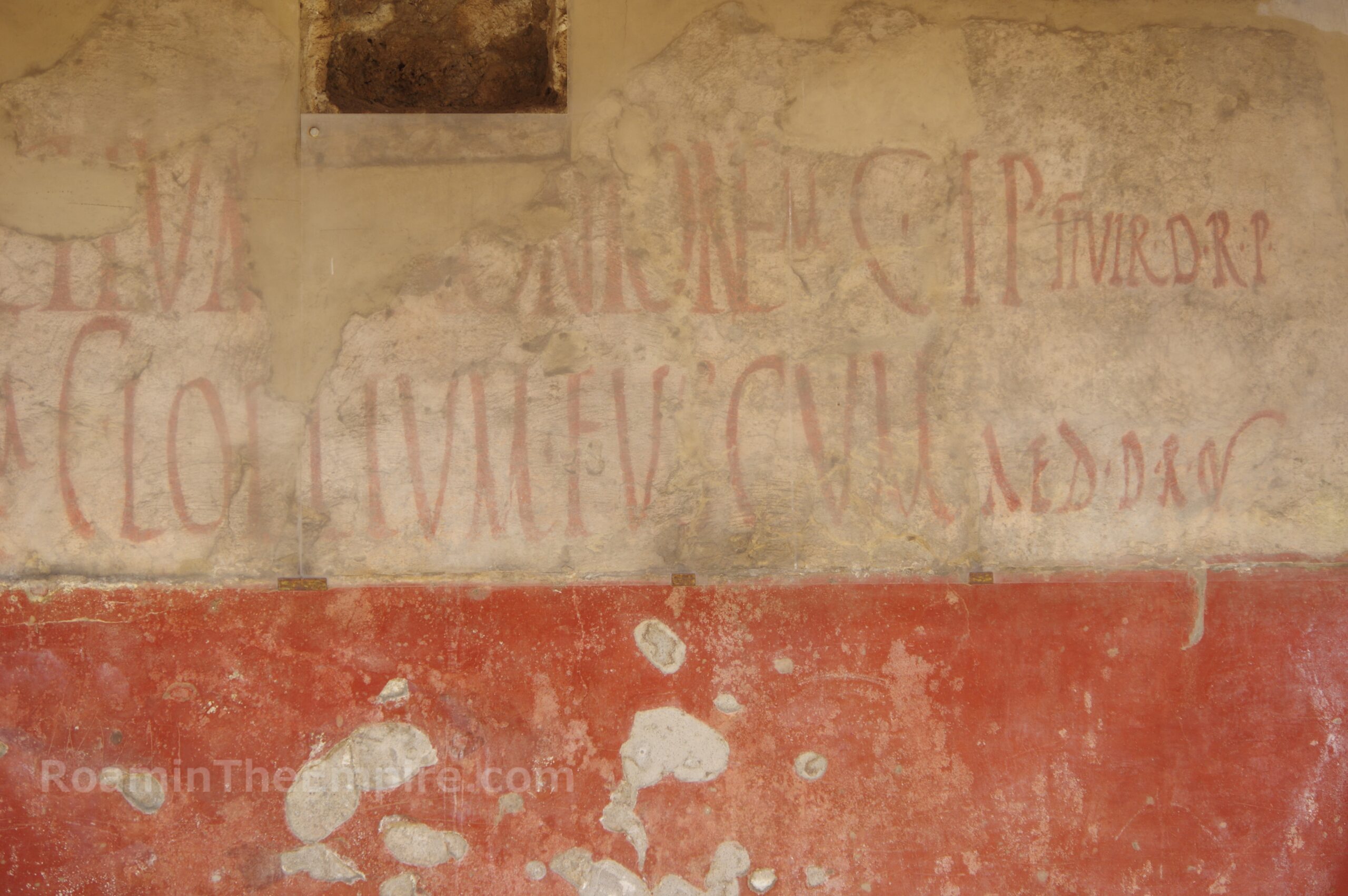 Painted electoral programmata from a wall in Pompeii encouraging a vote for Gaius Lollius Fucus for aedile.