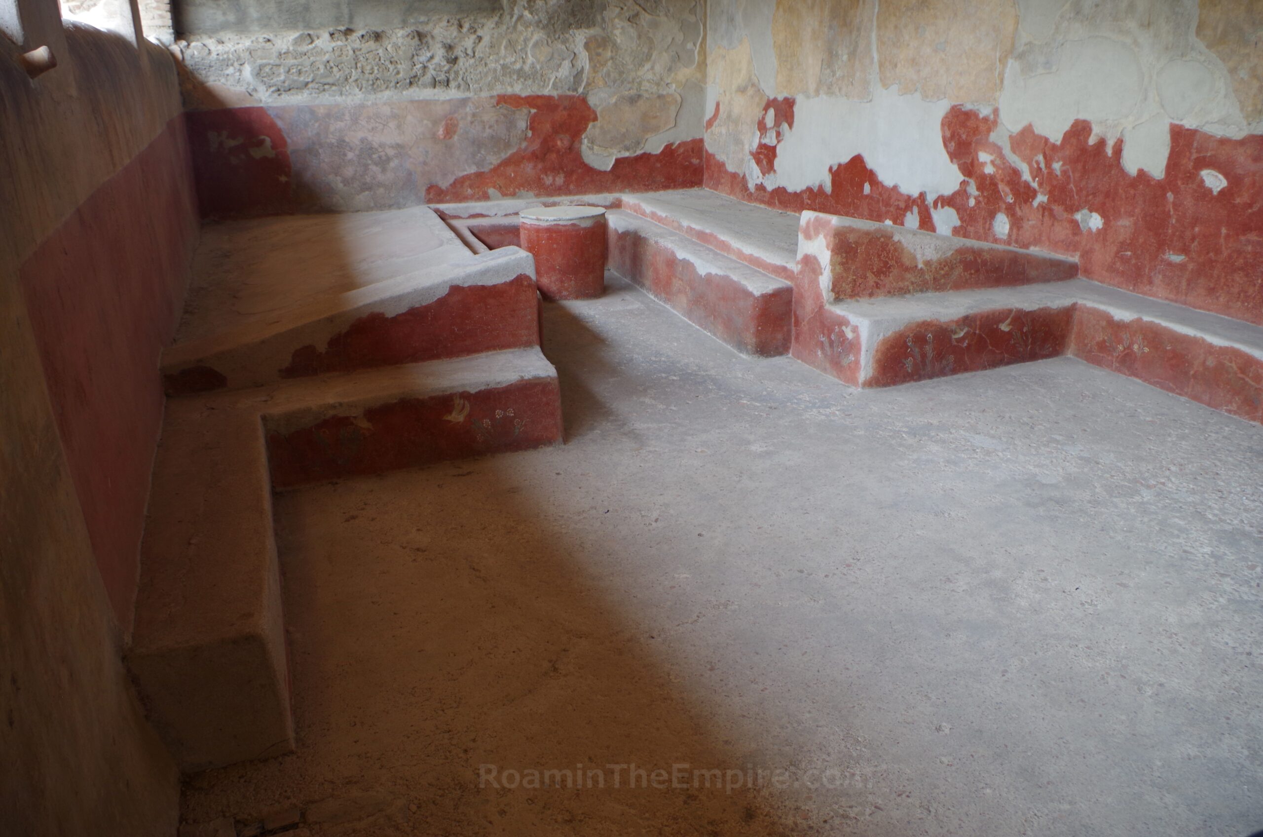 Triclinium with permanent lecti in the House of the Cryptoporticus in Pompeii.