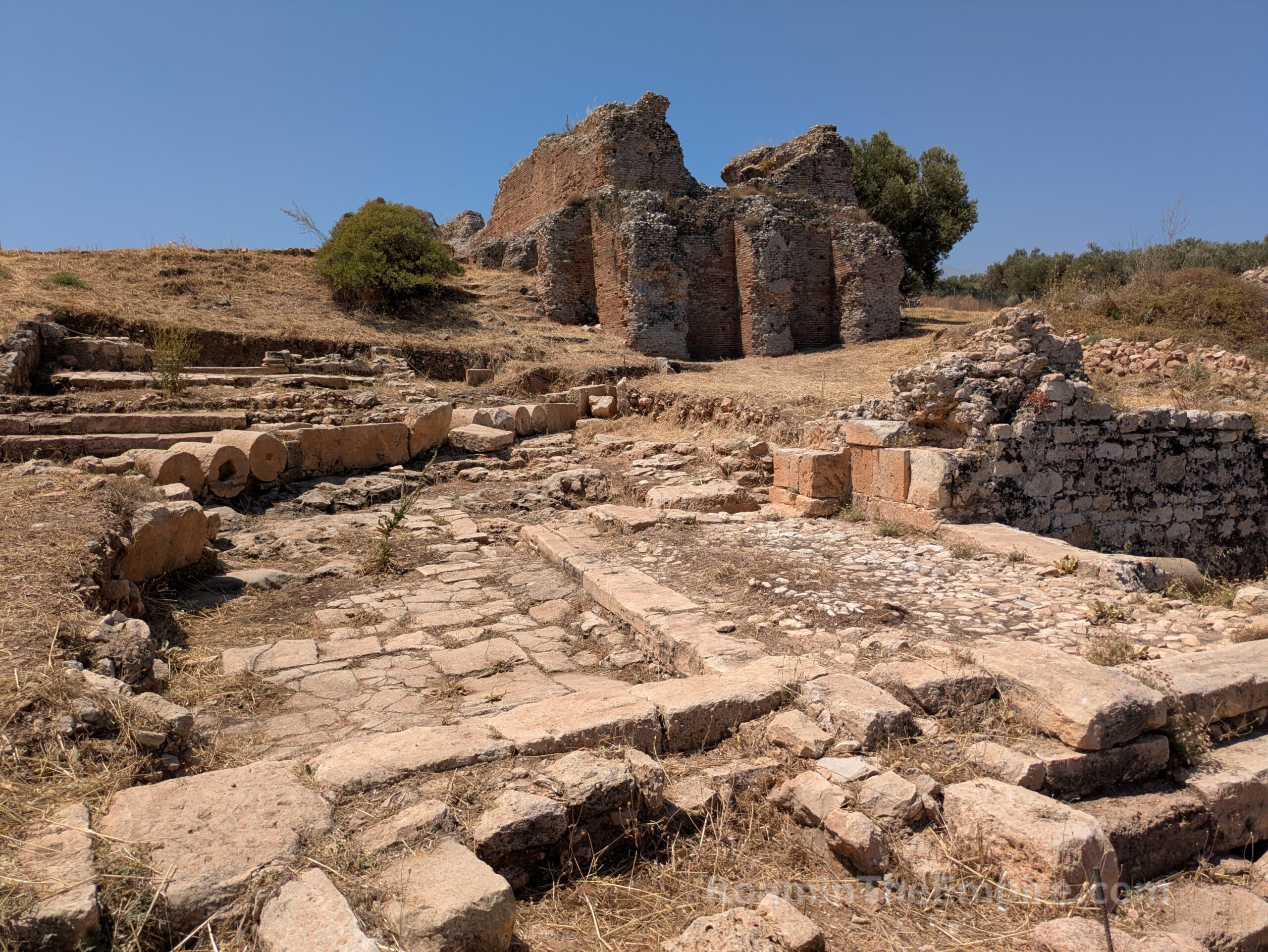 Roman buildings, Hellenistic road, and cistern.