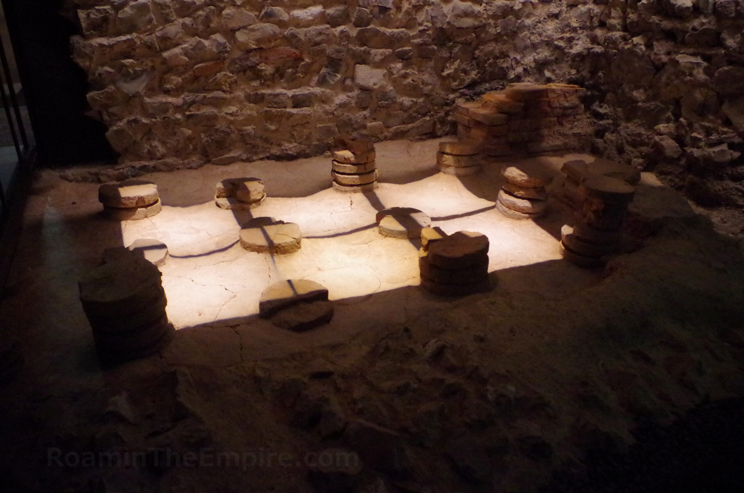 Small section of the hypocaust system of a heated room in a bathing area excavated in the Teseum.